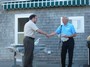 Treasurer Rich Medicke is congratulated by Orren Robbins